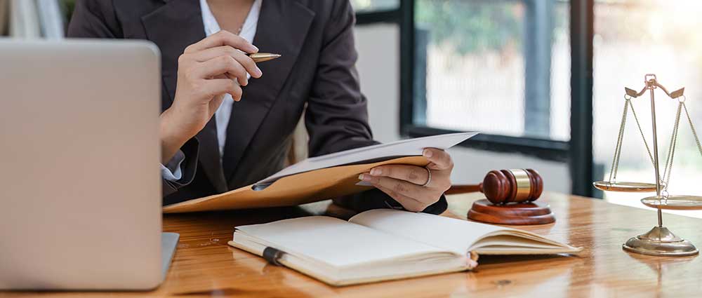 a lawyer reviewing her notes
