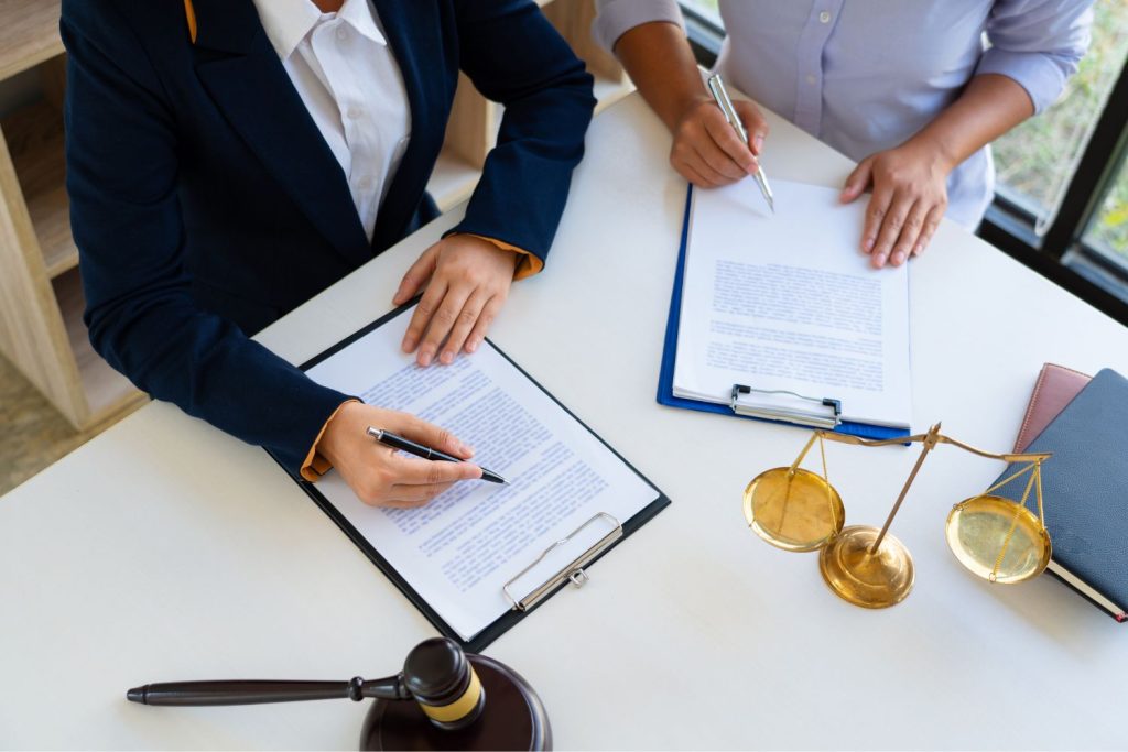 a lawyer and client discussing domestic violence allegations