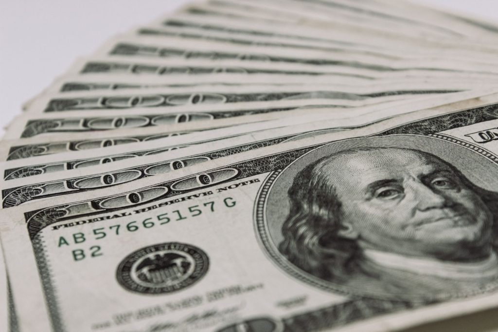 hundred dollar bills stacked