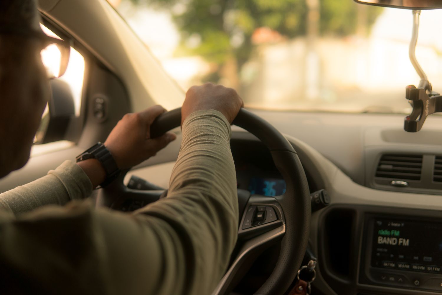 a close up image of someone driving a vehicle from the inside