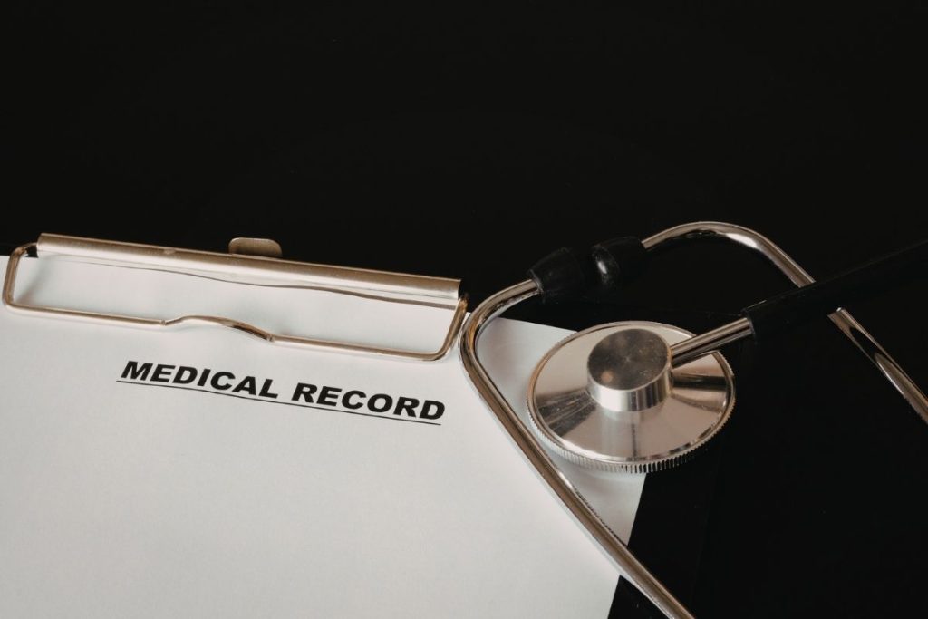 a paper that says "medical record" on a clipboard.